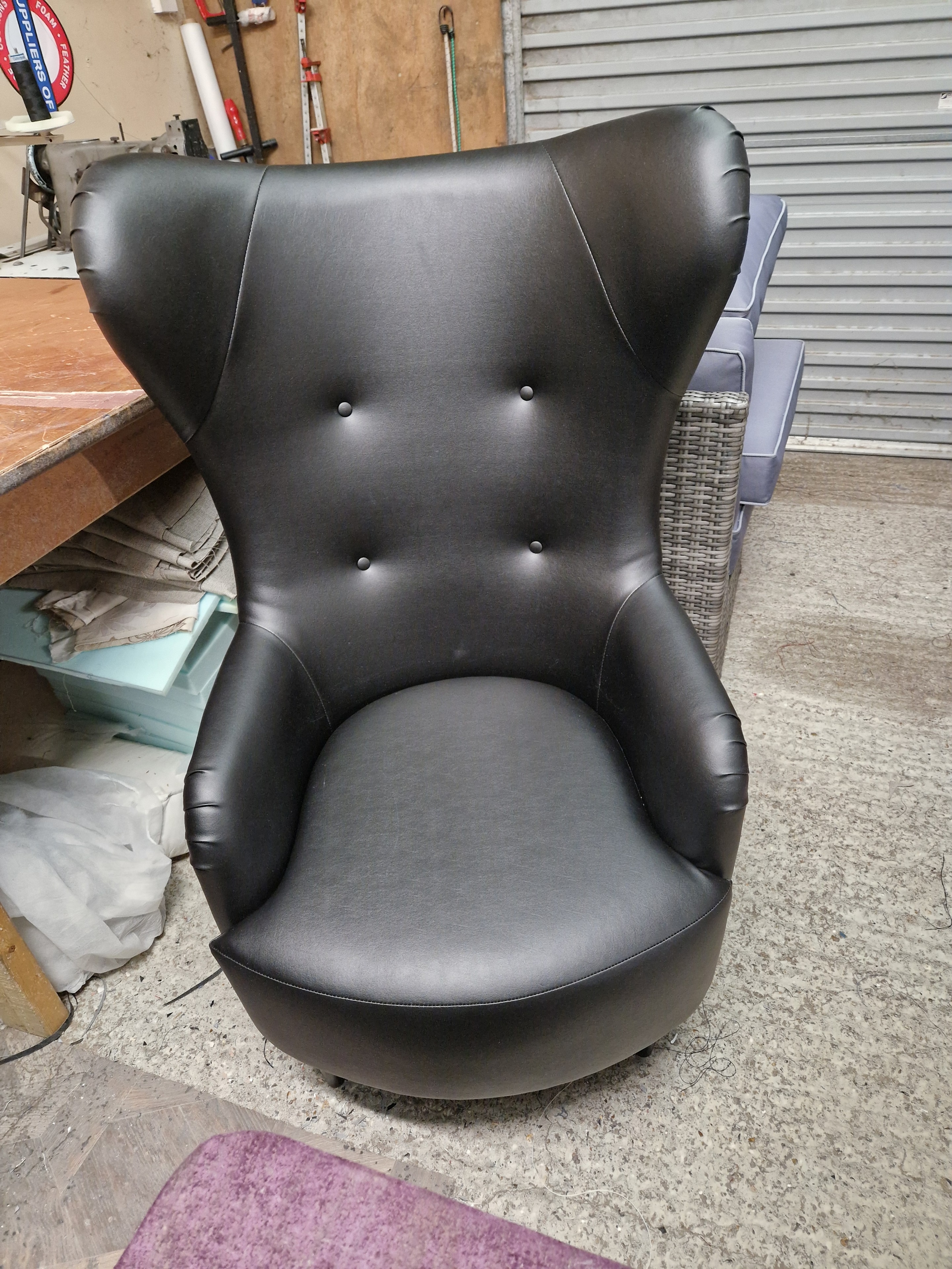 Black leather tub chair